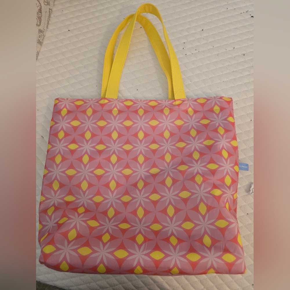 Stylish Pink and Yellow Clinique  Reversible Blue Tote Bag.